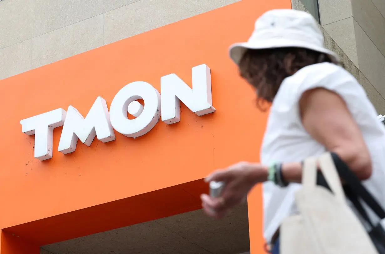 A person passes in front of TMON headquarters amid WeMakePrice and TMON, owned by Singapore-based e-commerce platform Qoo10, are facing increasingly delayed payments, in Seoul