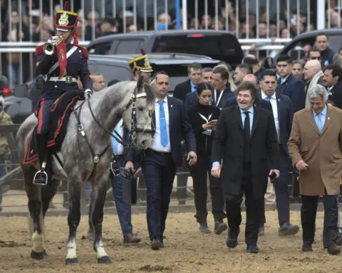 President Milei renews his vow to scrap export taxes as Argentina's powerful farmers get impatient