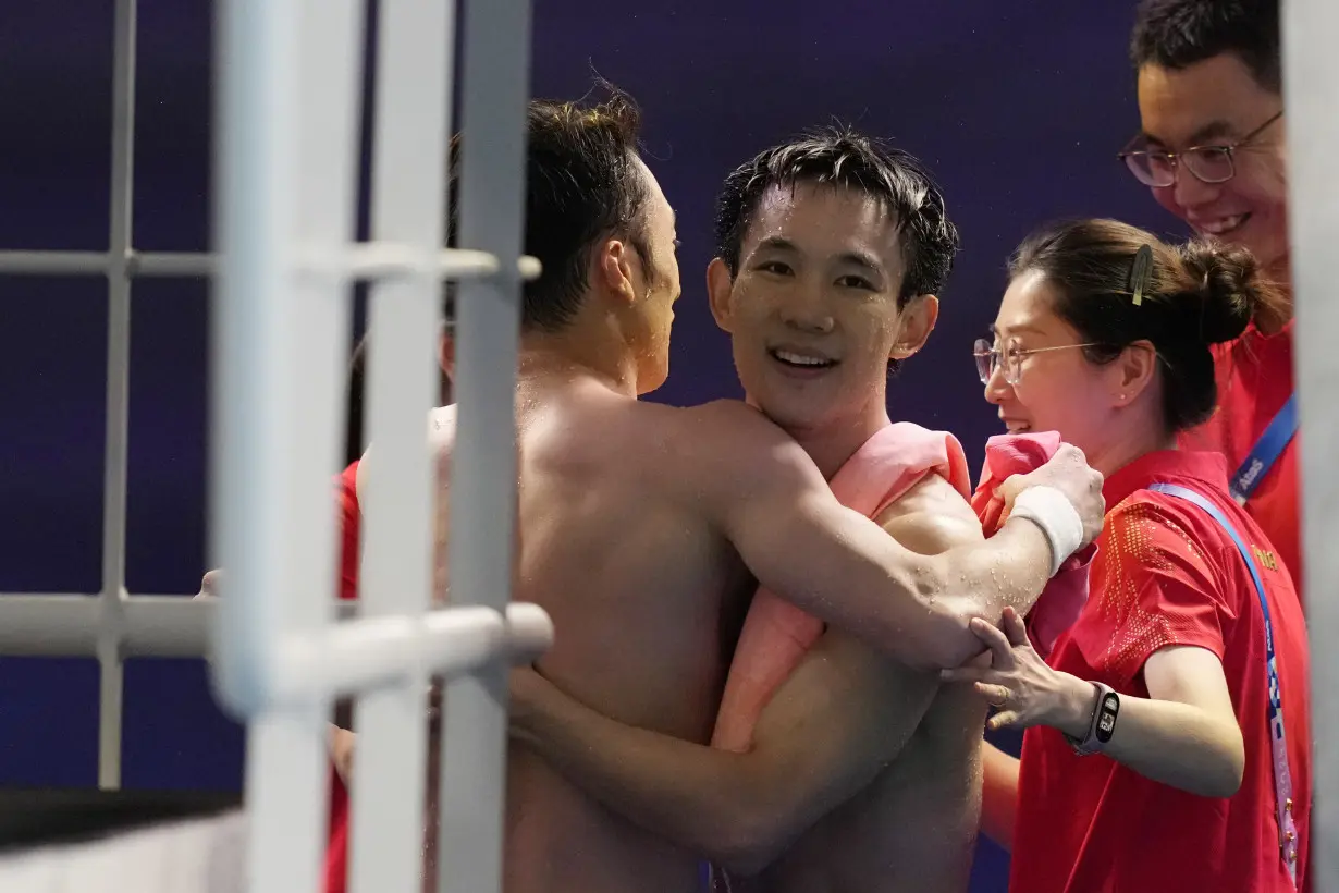 China makes it 2 for 2 in Olympic diving, leaving Britain's Tom Daley with a silver