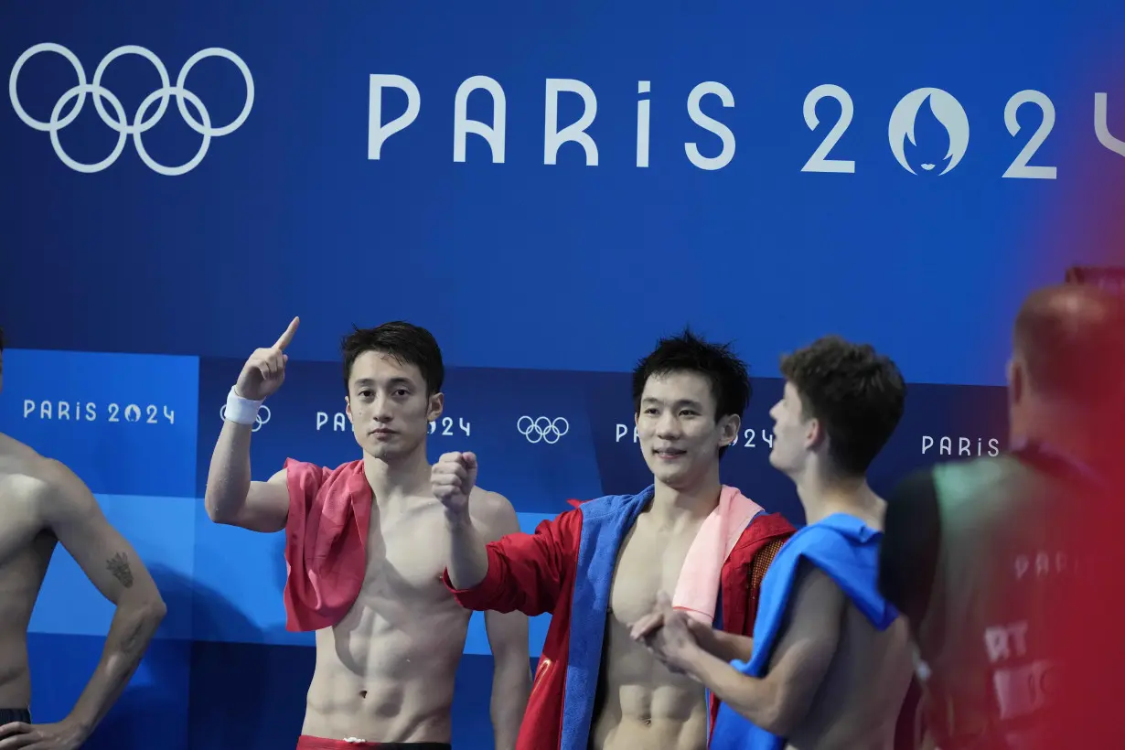 China makes it 2 for 2 in Olympic diving, leaving Britain's Tom Daley with a silver