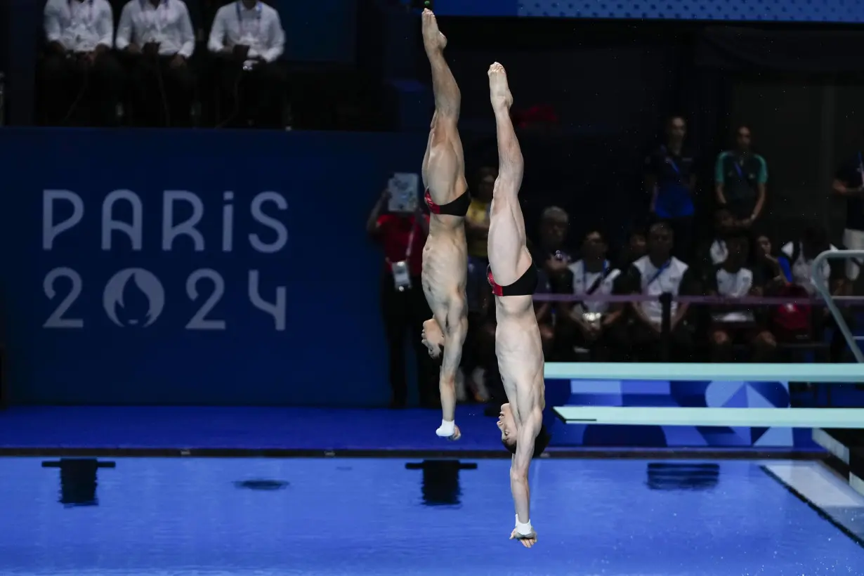 China makes it 2 for 2 in Olympic diving, leaving Britain's Tom Daley with a silver