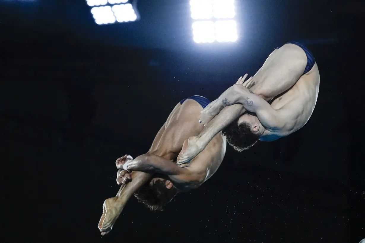 China makes it 2 for 2 in Olympic diving, leaving Britain's Tom Daley with a silver