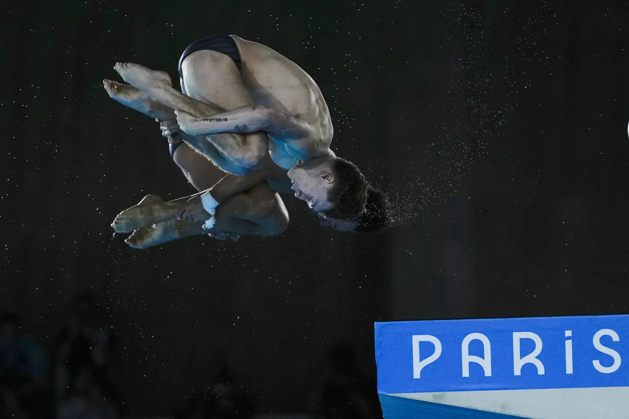 China makes it 2 for 2 in Olympic diving, leaving Britain's Tom Daley with a silver