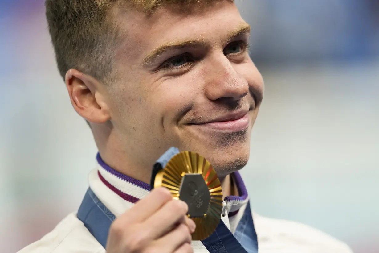 Longtime Phelps coach Bob Bowman was in tears watching new star pupil Léon Marchand win gold