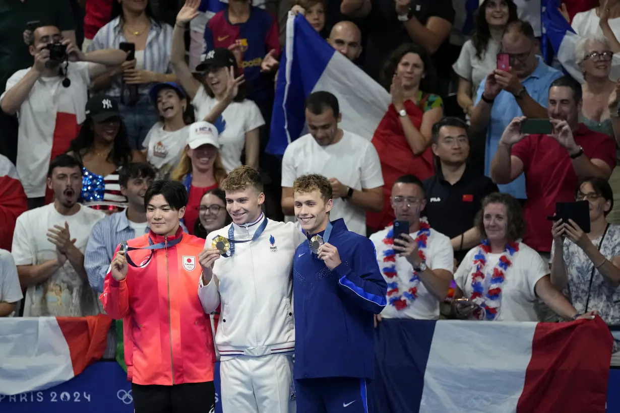 Longtime Phelps coach Bob Bowman was in tears watching new star pupil Léon Marchand win gold