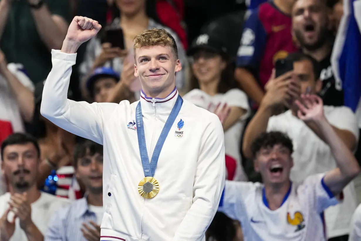 Longtime Phelps coach Bob Bowman was in tears watching new star pupil Léon Marchand win gold