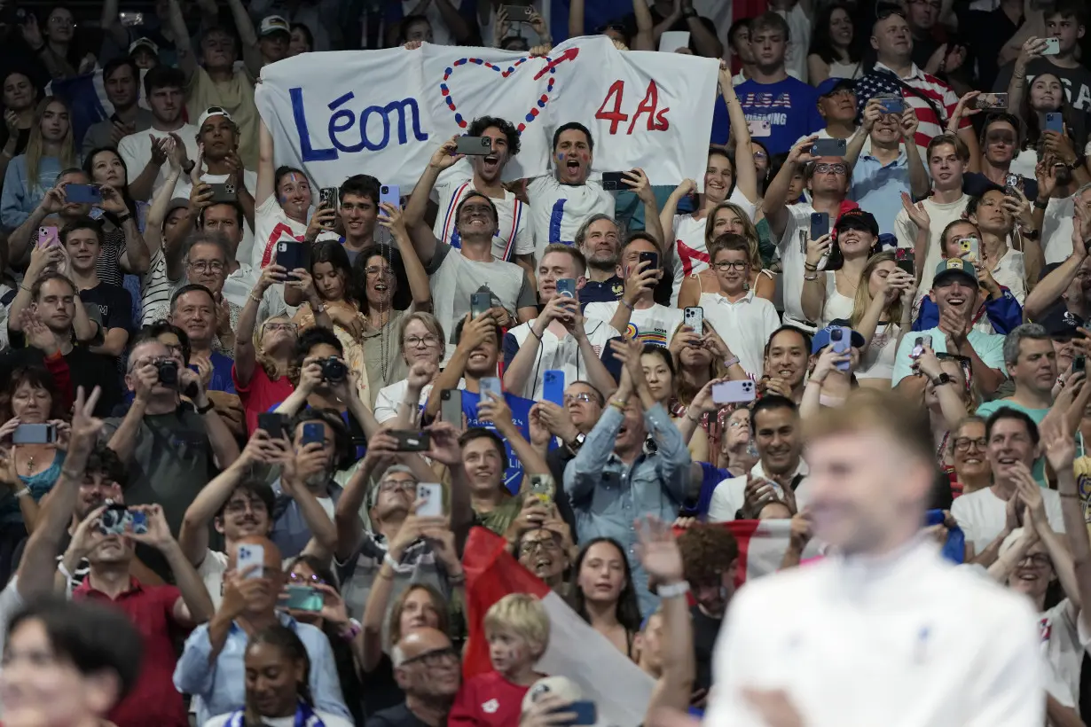 Longtime Phelps coach Bob Bowman was in tears watching new star pupil Léon Marchand win gold