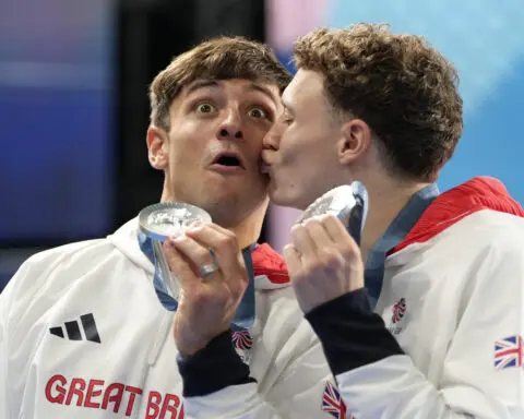China makes it 2 for 2 in Olympic diving, leaving Britain's Tom Daley with a silver
