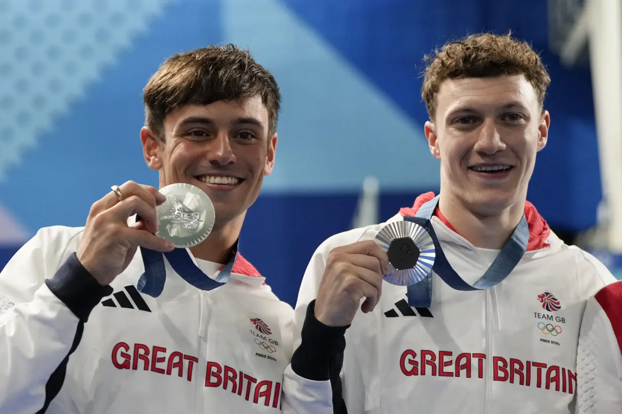 China makes it 2 for 2 in Olympic diving, leaving Britain's Tom Daley with a silver