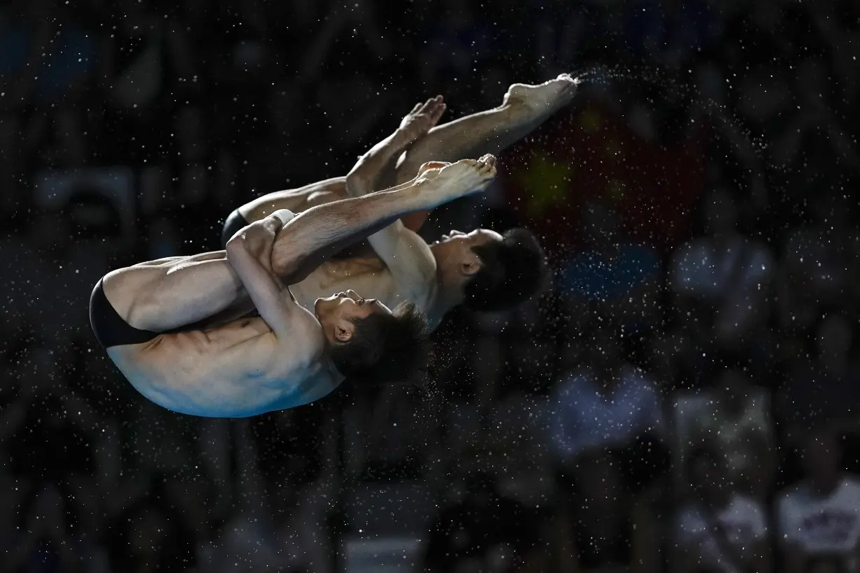 China makes it 2 for 2 in Olympic diving, leaving Britain's Tom Daley with a silver