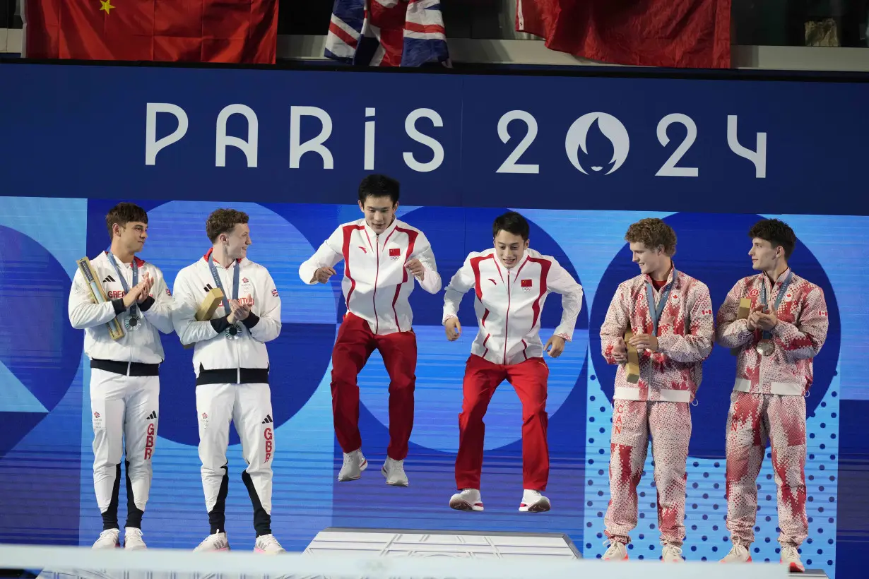 China makes it 2 for 2 in Olympic diving, leaving Britain's Tom Daley with a silver