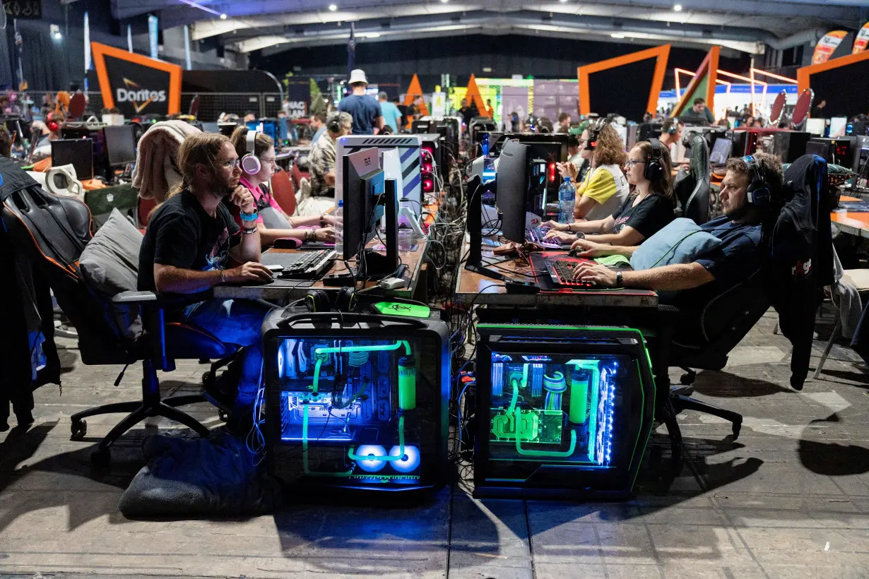 FILE PHOTO: Video gamers take part in 24 hour gaming competition during the rAge Expo, in Midrand