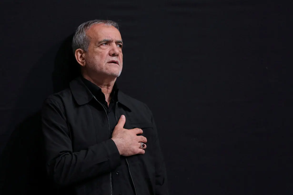 FILE PHOTO: Iran's President-elect Masoud Pezeshkian attends a Muharram mourning ceremony in Tehran