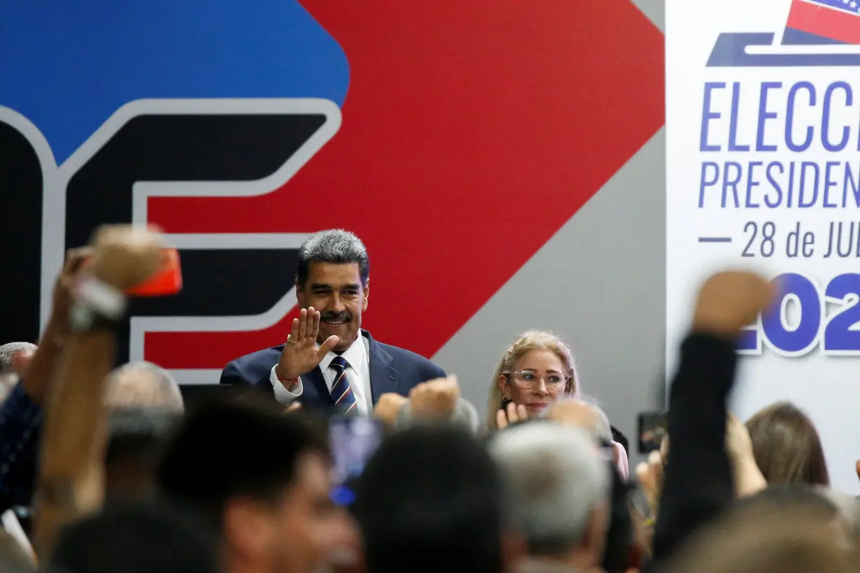 Venezuela's President Nicolas Maduro meets with Elvis Amoroso, head of the CNE, in Caracas