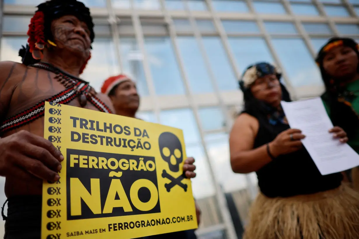 Munduruku Indigenous people stand together before filing a letter of rupture with the Ferrograo railway working group at the Ministry of Transport in Brasilia