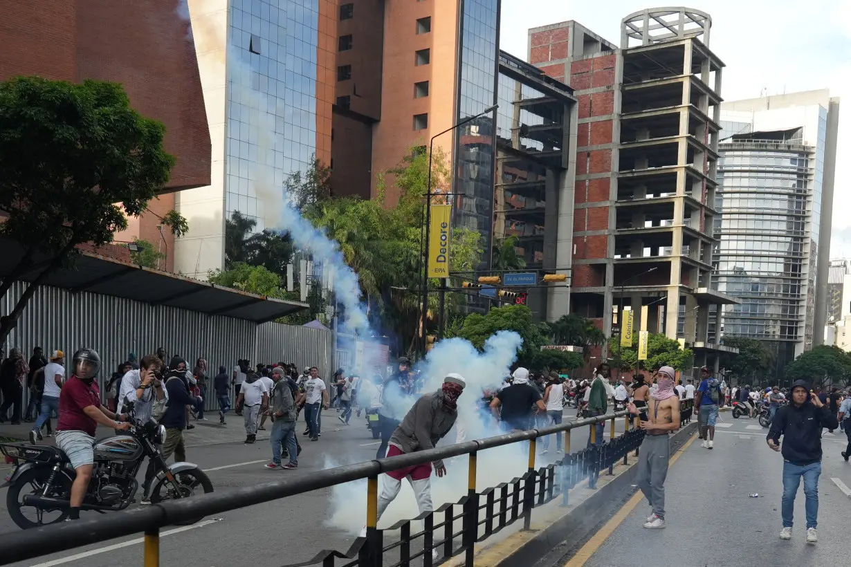 Supporters of the Venezuelan opposition demonstrate following the announcement that Venezuela's President Maduro won the presidential election, in Caracas