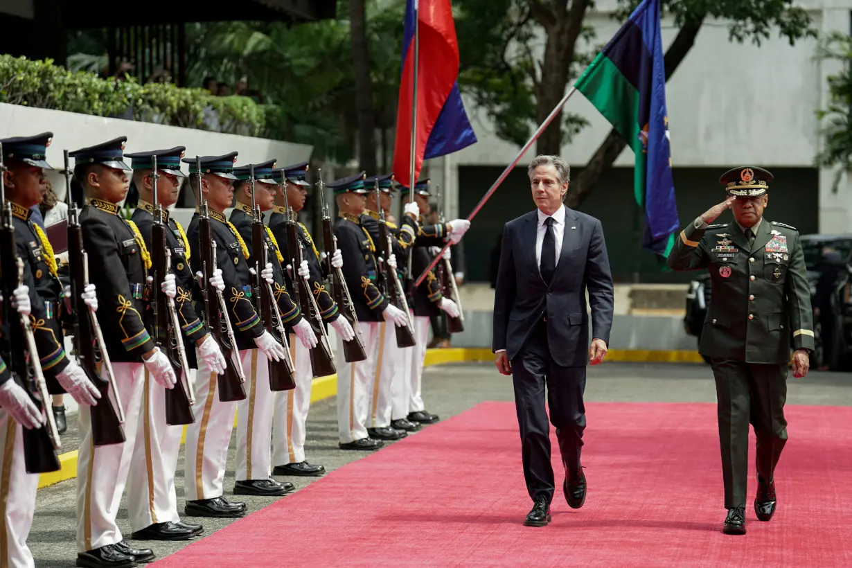 U.S. Secretary of State Antony Blinken and Philippine Army Chief of Staff Romeo Brawner Jr. inspect honour guards during their arrival at Camp Aguinaldo, in Quezon City