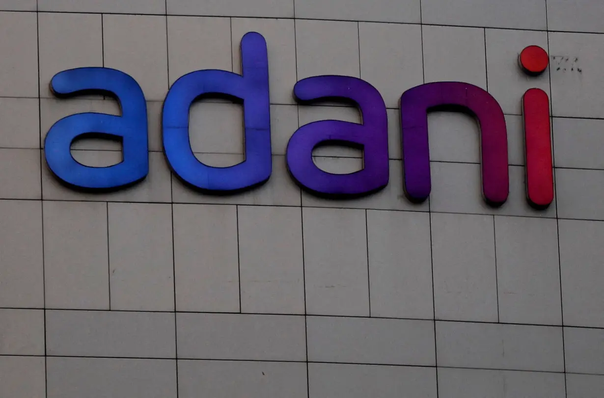 FILE PHOTO: FILE PHOTO: The logo of the Adani Group is seen on the facade of its Corporate House on the outskirts of Ahmedabad, India