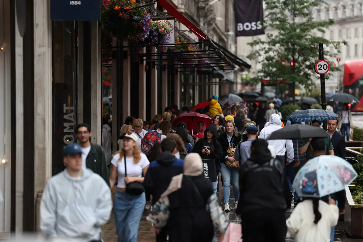 Shoppers walk along Regent Street in London