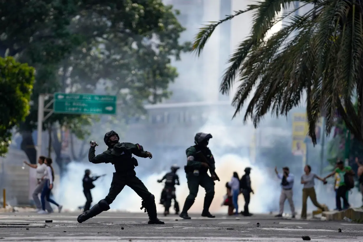 Police and protesters clashed in Caracas, Venezuela, on July 29, with police firing tear gas to disperse large crowds.