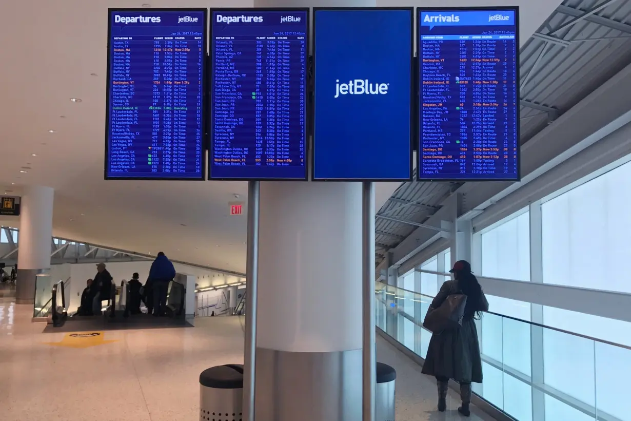 A JetBlue Airways flight status monitor is seen at John F. Kennedy Airport in the Queens borough of New York