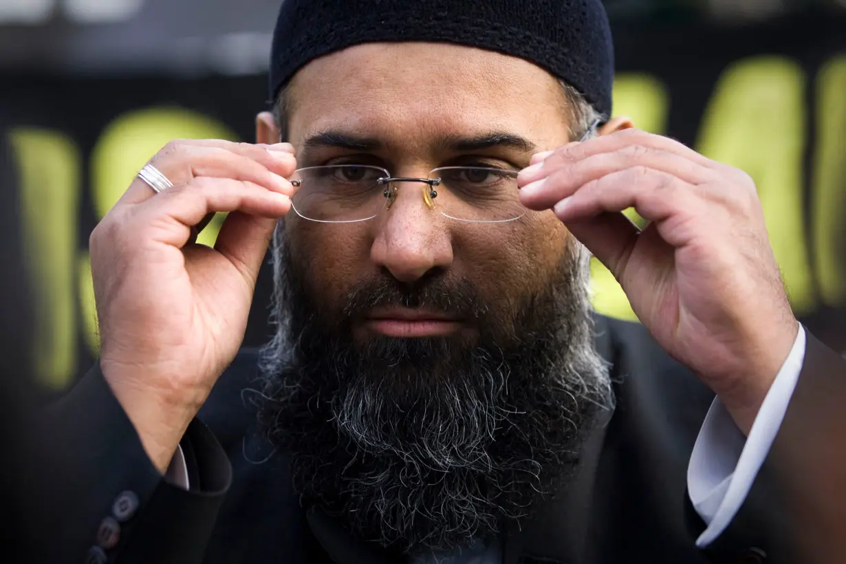 Islamic preacher Choudary addresses members of the media during a protest supporting the Shari'ah Law, in north London