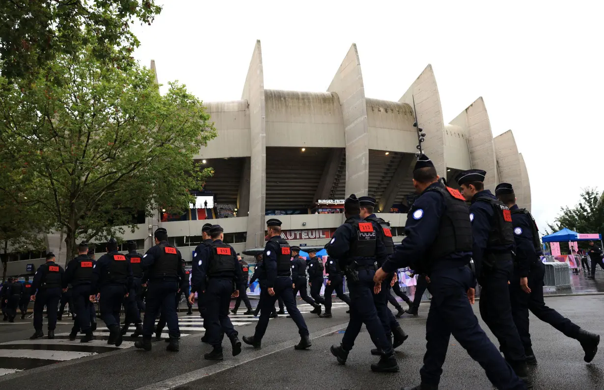 Security officers are seen outside the Parc des Princes stadium prior to the men's group D match between Israel and Paraguay during the Olympic Games on July 27.