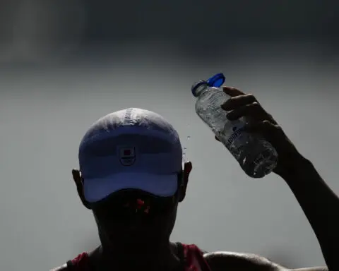 Paris Olympics brings out hoses and misters to cool down fans during heat wave