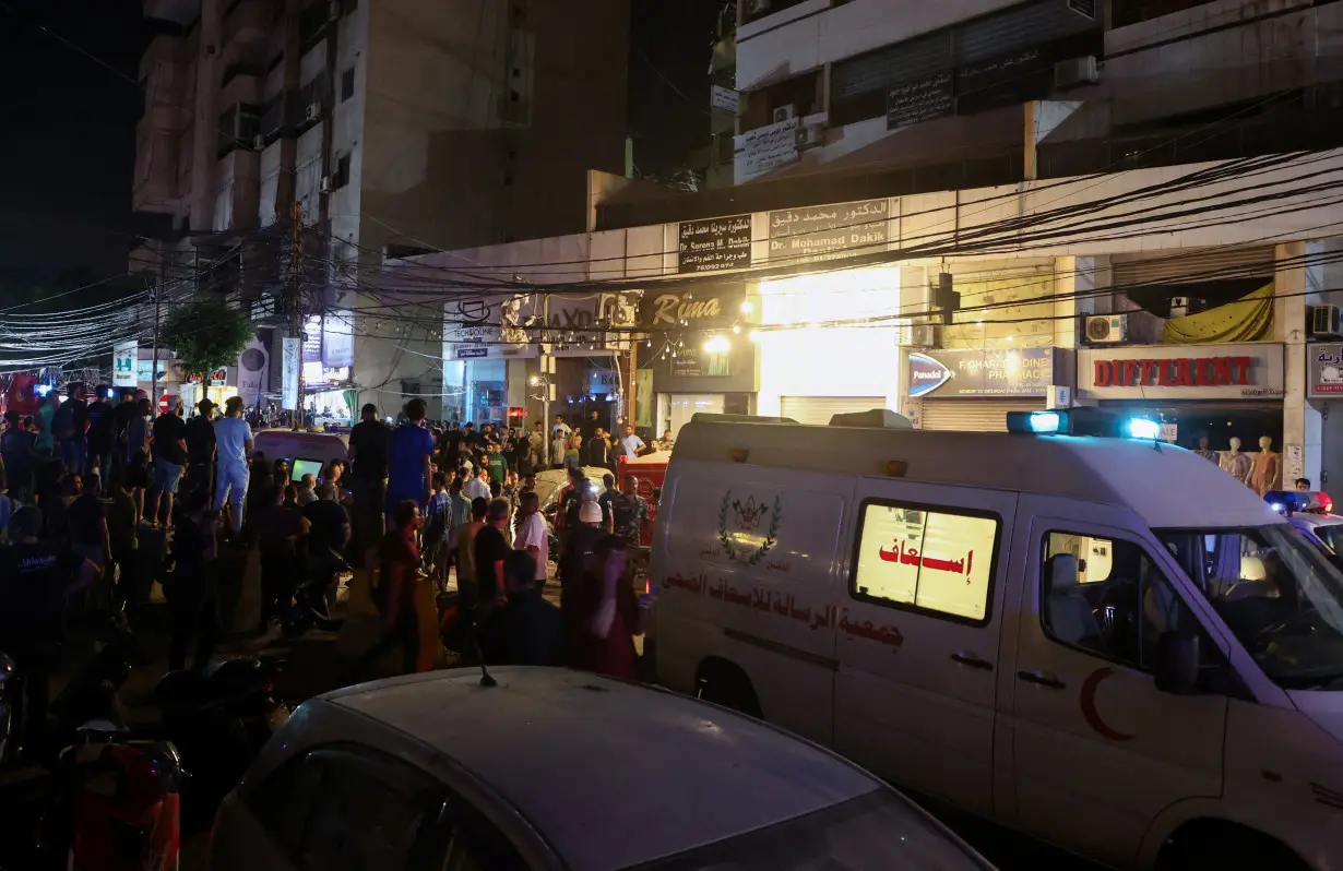 An ambulance is parked near a site hit by what security sources said was a strike on Beirut's southern suburbs