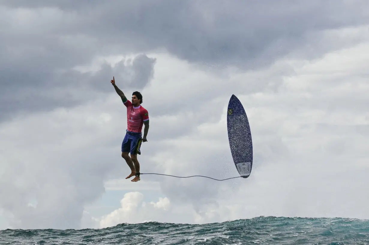 Brazil's Gabriel Medina reacts after getting a large wave in the 5th heat of the men's surfing round 3, during the Paris 2024 Olympic Games, in Teahupo'o, on the French Polynesian Island of Tahiti, on Monday, July 29.