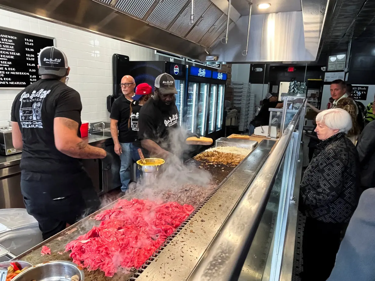 U.S. Treasury Secretary Janet Yellen orders a 'Wiz Wit' cheesesteak sandwich at Jim's South St. sandwich shop after an event with Pennsylvania's Governor Josh Shapiro, in Philadelphia