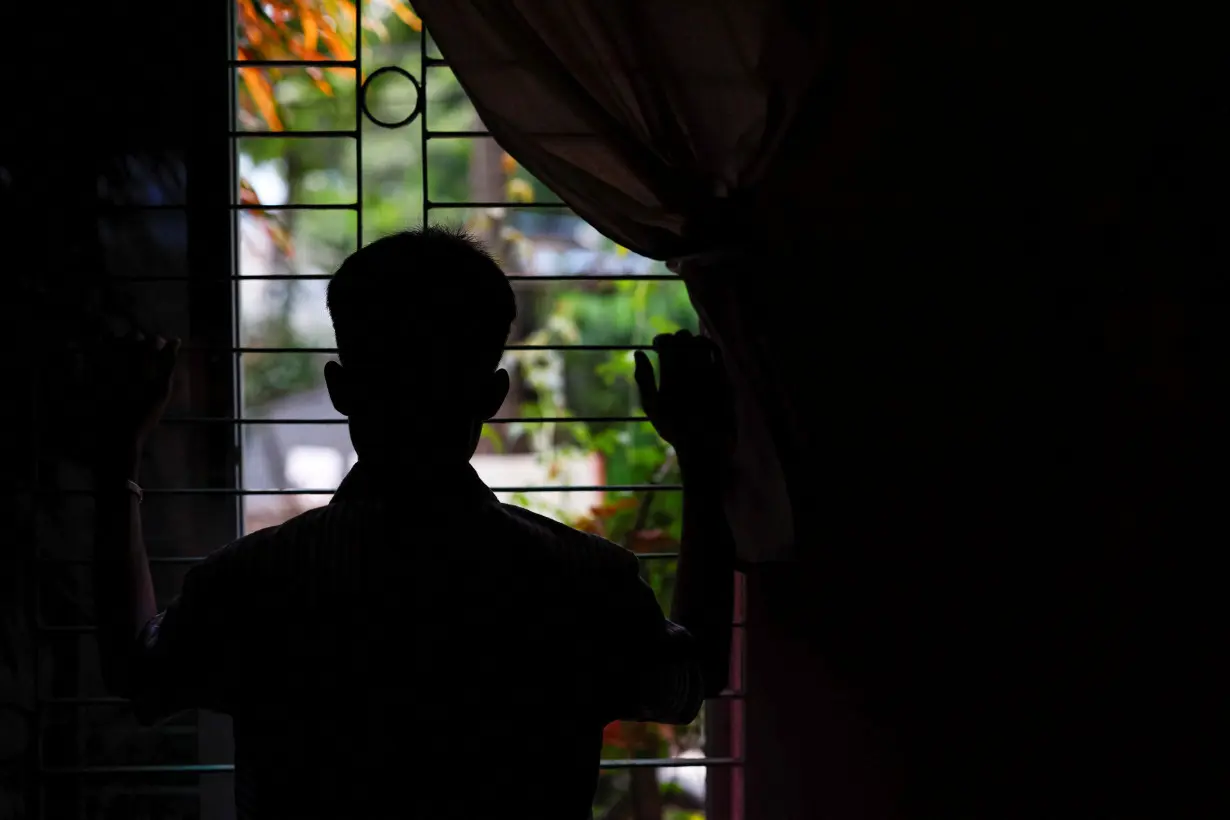 A 15-year-old Rohingya boy, who said he was abducted for conscription by a military-alligned Rohingya insurgent group, poses for a picture in Cox's Bazar