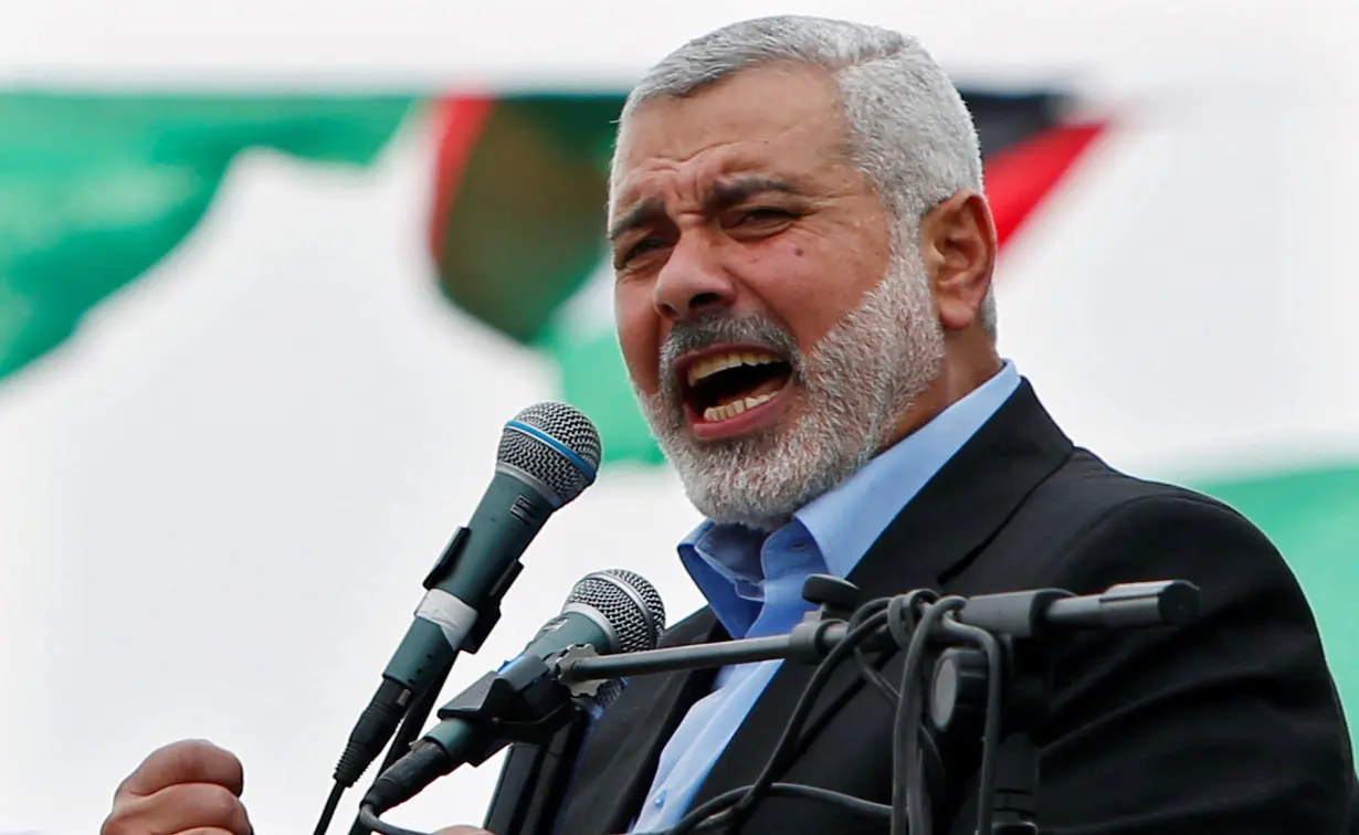 FILE PHOTO: Haniyeh talks to his supporters during a Hamas rally marking the anniversary of the death of its leaders killed by Israel, in Gaza