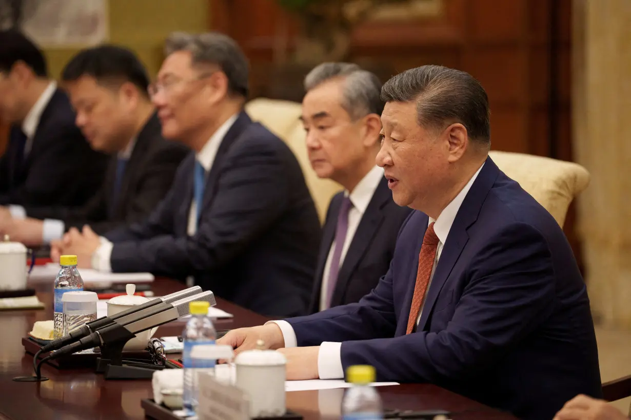 FILE PHOTO: Chinese President Xi Jinping and his delegation attend a meeting with Italian Premier Giorgia Meloni, at the Diaoyutai State Guesthouse in Beijing