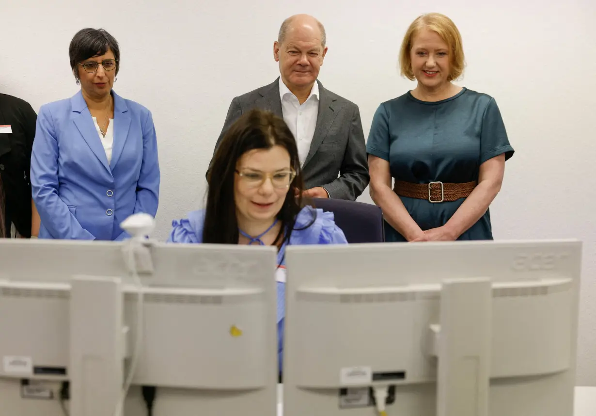 FILE PHOTO: German Chancellor Scholz visits the Berlin-Brandenburg children's benefits office in Potsdam