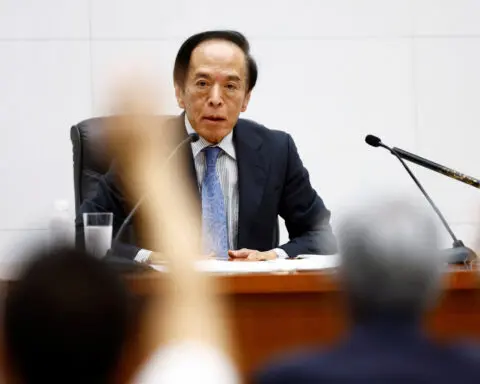 BOJ lifts rates, signals slow end to historic bond buying binge