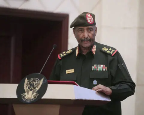 Sudan's military leader survives a drone strike that killed 5, says the army