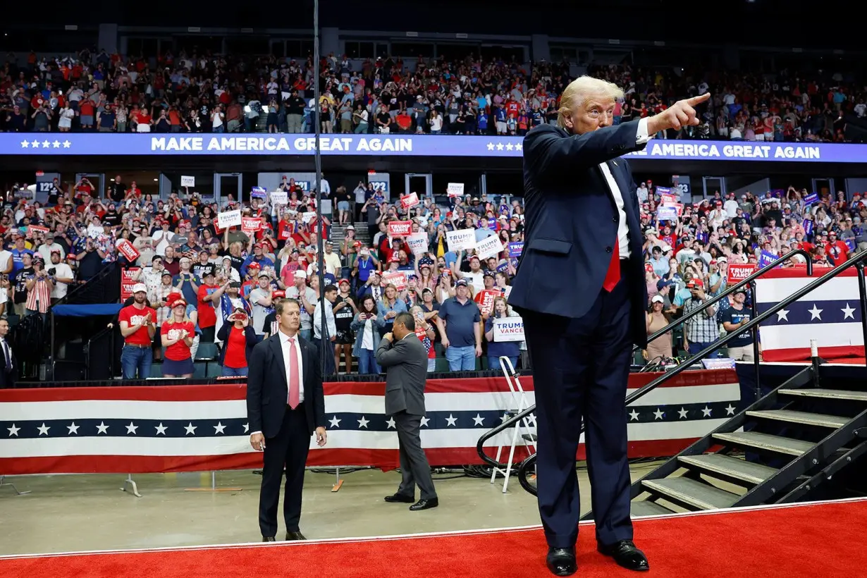 Former President Donald Trump walks offstage after speaking at a campaign rally in Grand Rapids, Michigan, on July 20.