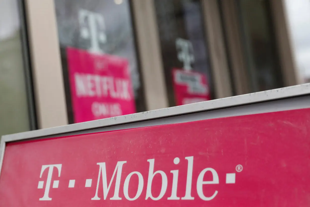 FILE PHOTO: A sign for a T-Mobile store is seen in Manhattan, New York