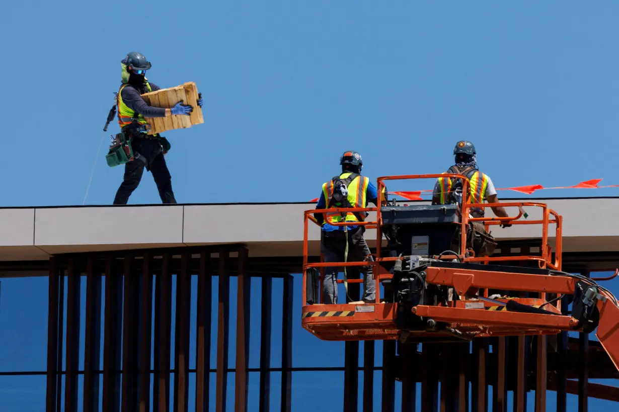 FILE PHOTO: Workers in the heat of the California sun