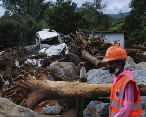 Rescuers search through mud and debris as deaths rise to 166 in landslides in southern India