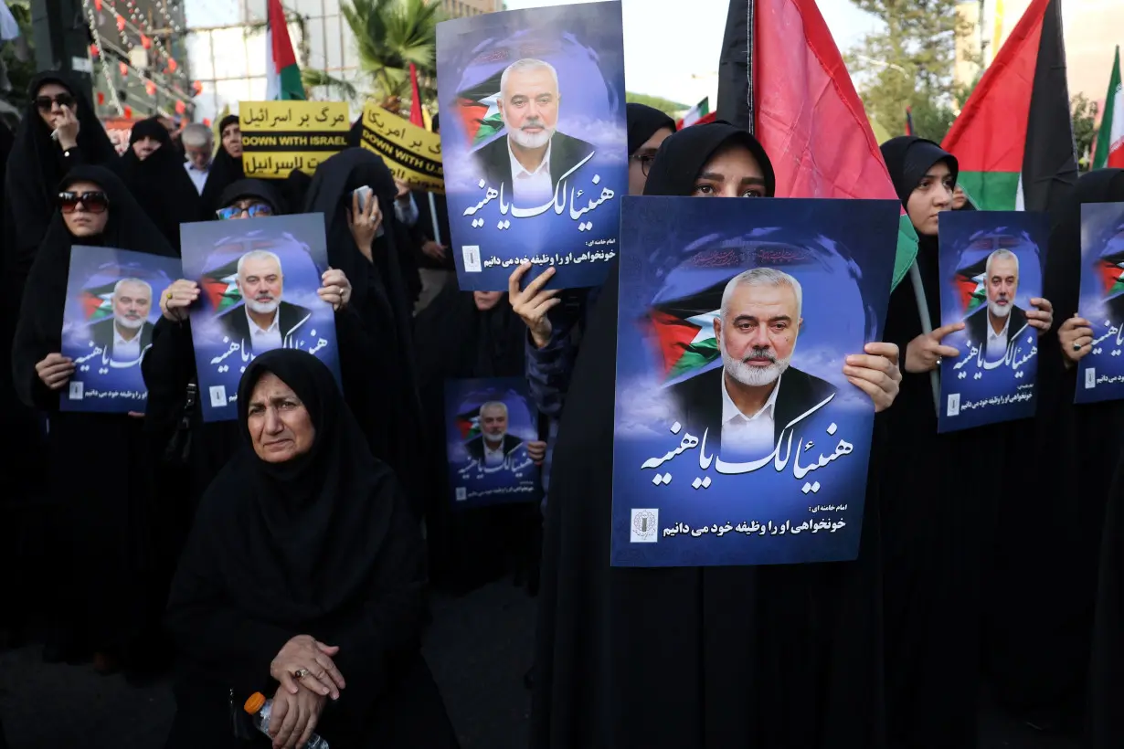 People attend an anti-Israel gathering following the killing of Palestinian group Hamas' leader Ismail Haniyeh, amid the ongoing conflict between Israel and Hamas, in Tehran