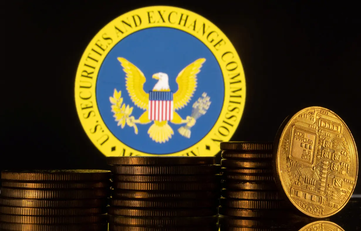 Illustration shows U.S. Securities and Exchange Commission logo and representations of cryptocurrency