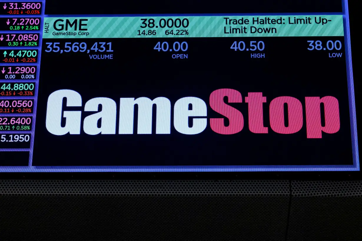 FILE PHOTO: A screen displays GameStop stock trading information on the floor of the NYSE in New York
