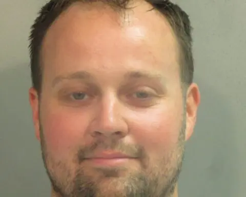 Former reality TV star Josh Duggar signs autographs behind bars