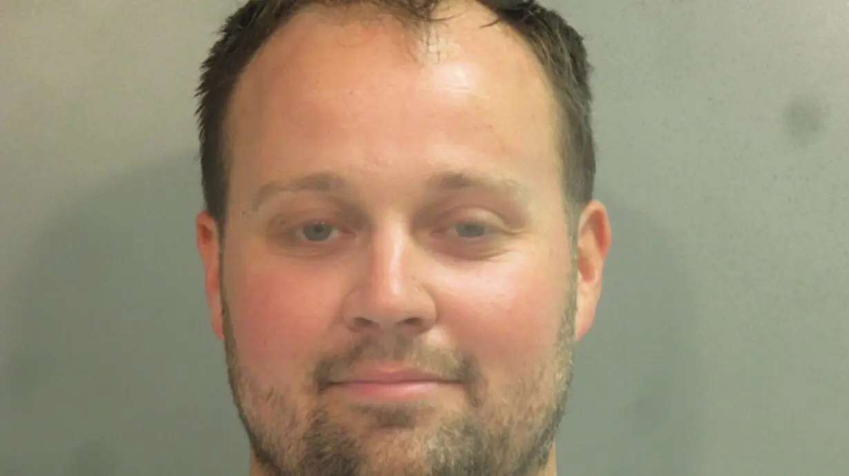 Former reality TV star Josh Duggar signs autographs behind bars