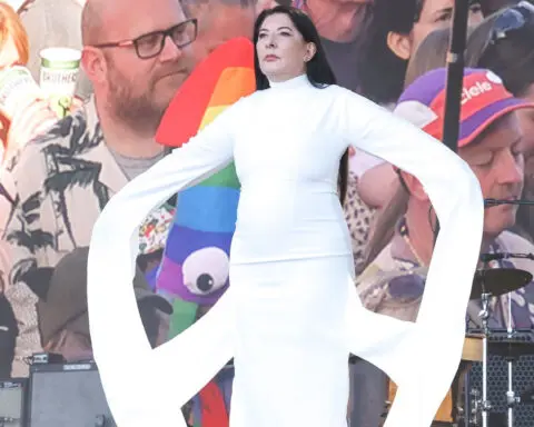Look of the Week: An artist and her ‘peace’ dress silenced Glastonbury for 7 minutes