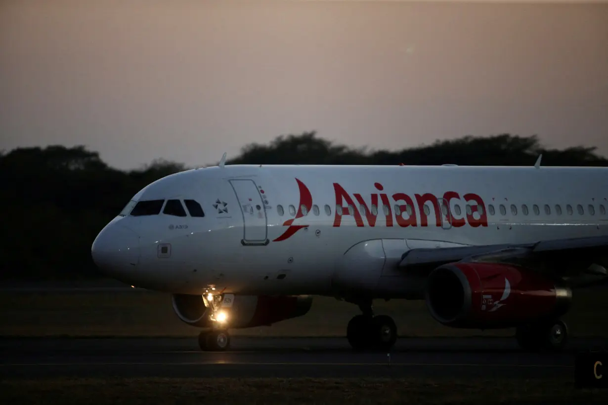 FILE PHOTO: An Avianca Airlines plane prepares to take off at the San Oscar Arnulfo Romero International Airport in San Luis Talpa