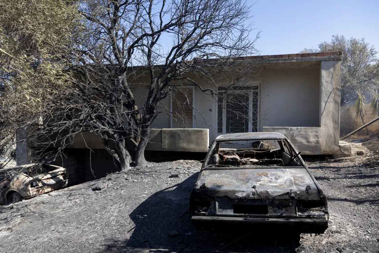 Firefighters battle wildfires on 2 Greek islands as premier warns of a dangerous summer