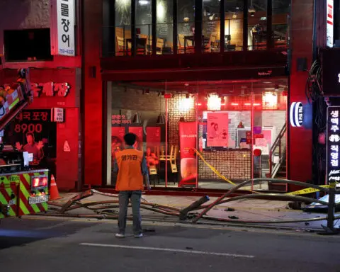 Car drives into crowd near Seoul city hall, nine dead